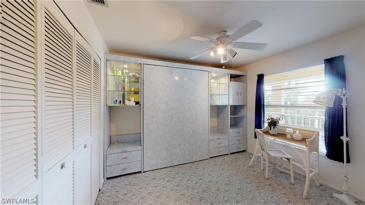1100 Pondella Road, Unit 811 Cape Coral, FL 33909 - Photo 15 of 35 a very nice looking room with a large window and chandelier