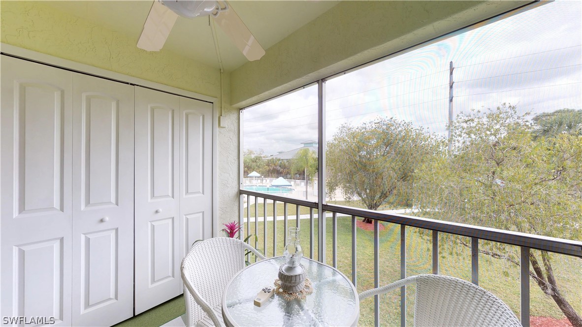 1100 Pondella Road, Unit 811 Cape Coral, FL 33909 - Photo 20 of 35 a balcony view with a large window and outdoor space
