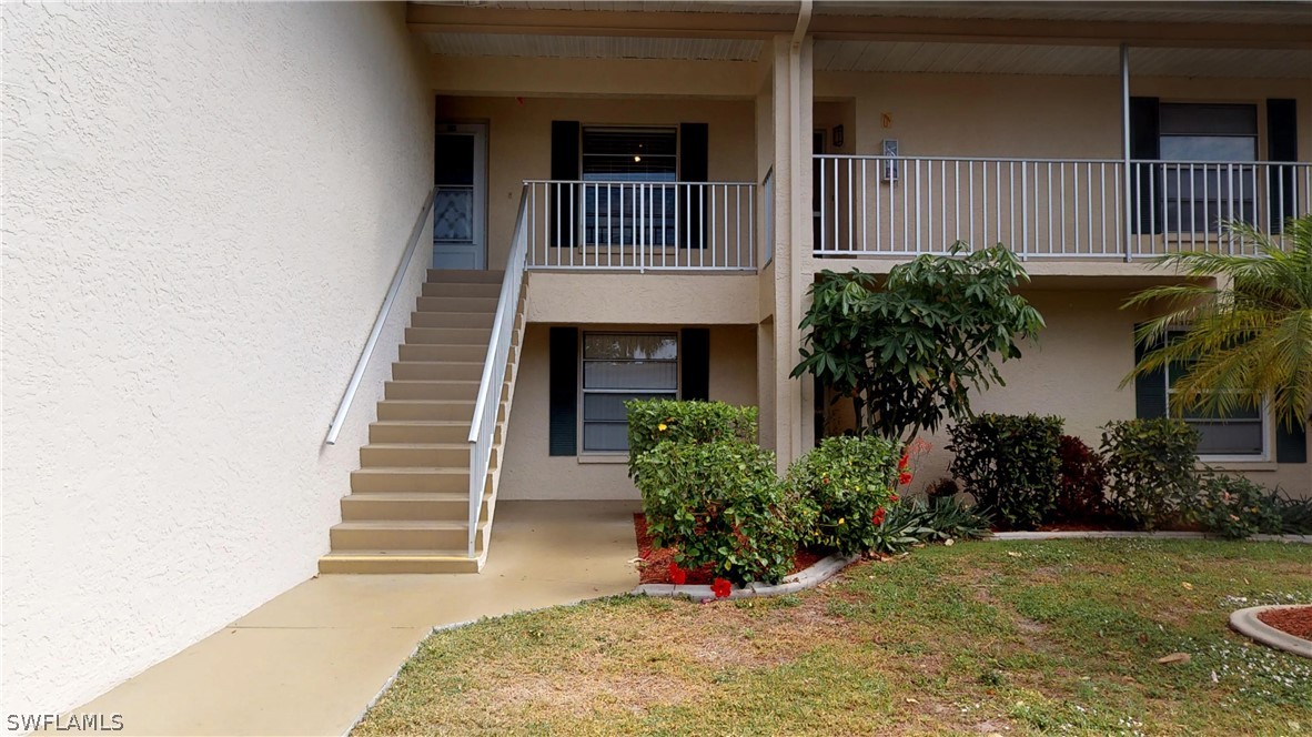 1100 Pondella Road, Unit 811 Cape Coral, FL 33909 - Photo 23 of 35 a view of a house with a yard