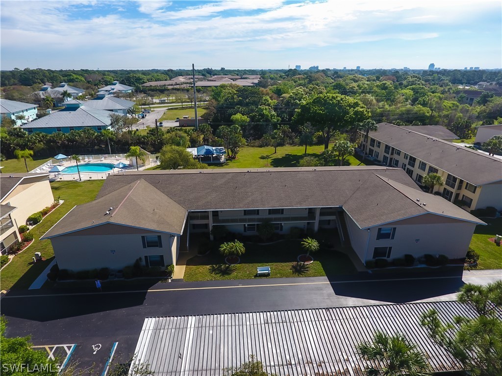 1100 Pondella Road, Unit 811 Cape Coral, FL 33909 - Photo 24 of 35 a aerial view of a house with a garden
