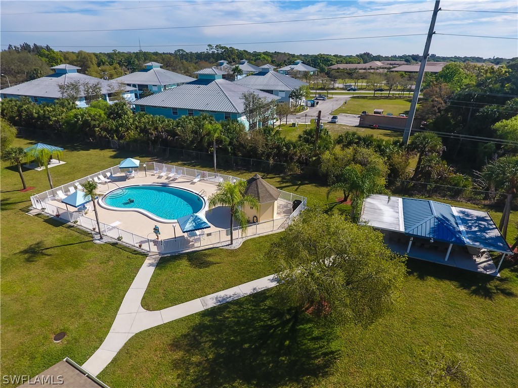 1100 Pondella Road, Unit 811 Cape Coral, FL 33909 - Photo 26 of 35 an aerial view of residential houses with outdoor space