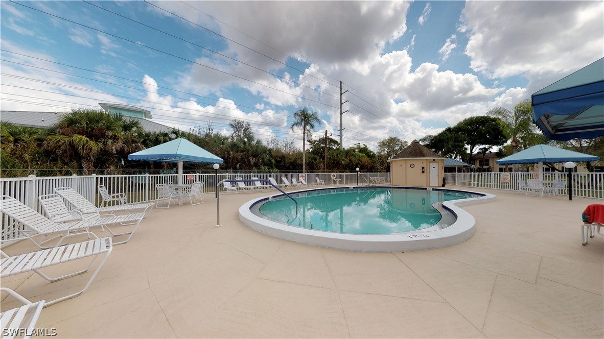 1100 Pondella Road, Unit 811 Cape Coral, FL 33909 - Photo 28 of 35 a roof deck with a table and chairs