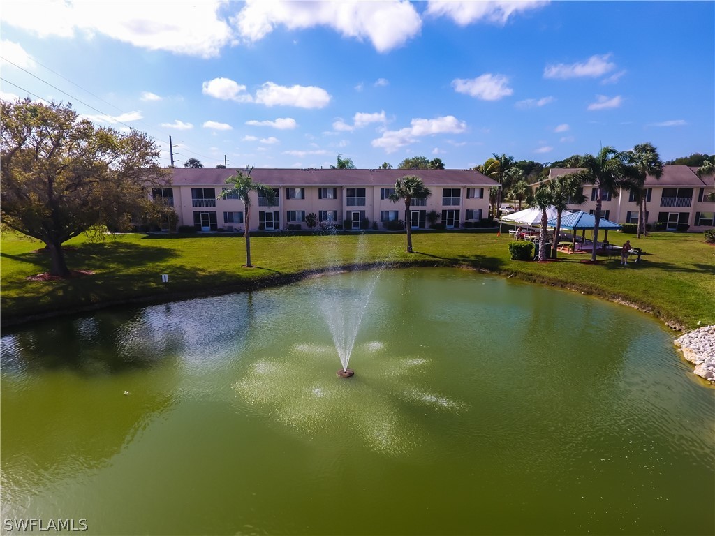 1100 Pondella Road, Unit 811 Cape Coral, FL 33909 - Photo 31 of 35 a view of houses with swimming pool and yard