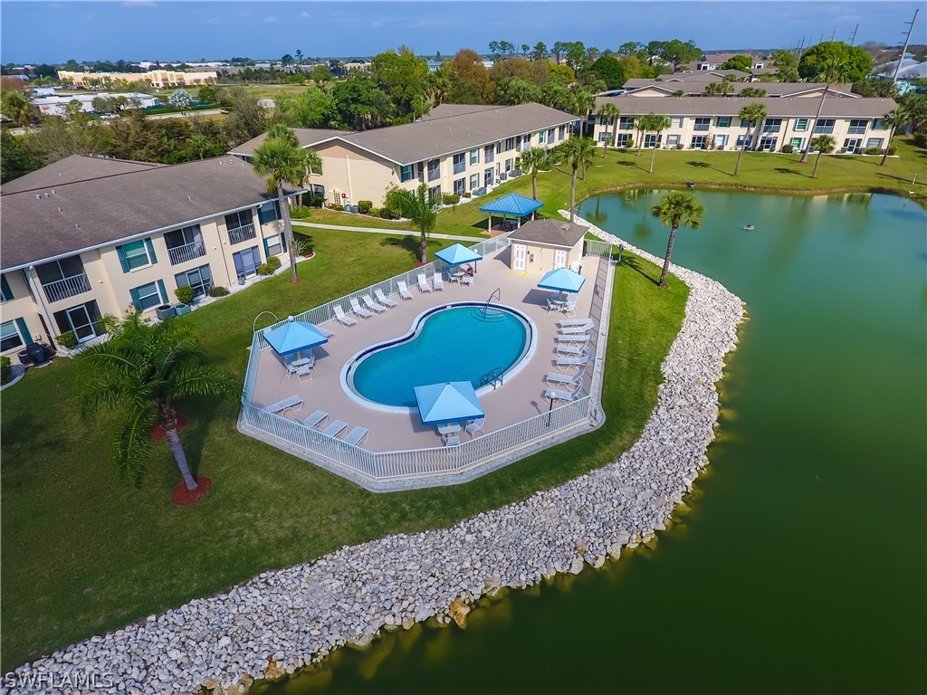1100 Pondella Road, Unit 811 Cape Coral, FL 33909 - Photo 33 of 35 an aerial view of a house with a lake view