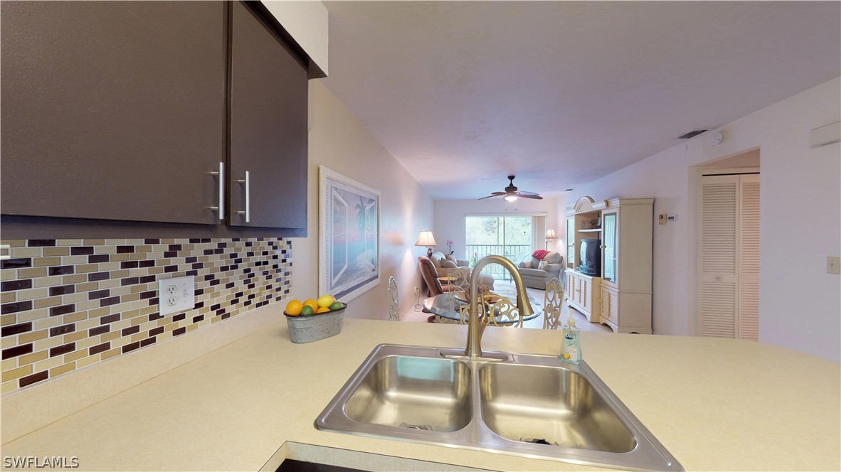 1100 Pondella Road, Unit 811 Cape Coral, FL 33909 - Photo 5 of 35 a view of a kitchen with a sink and toys