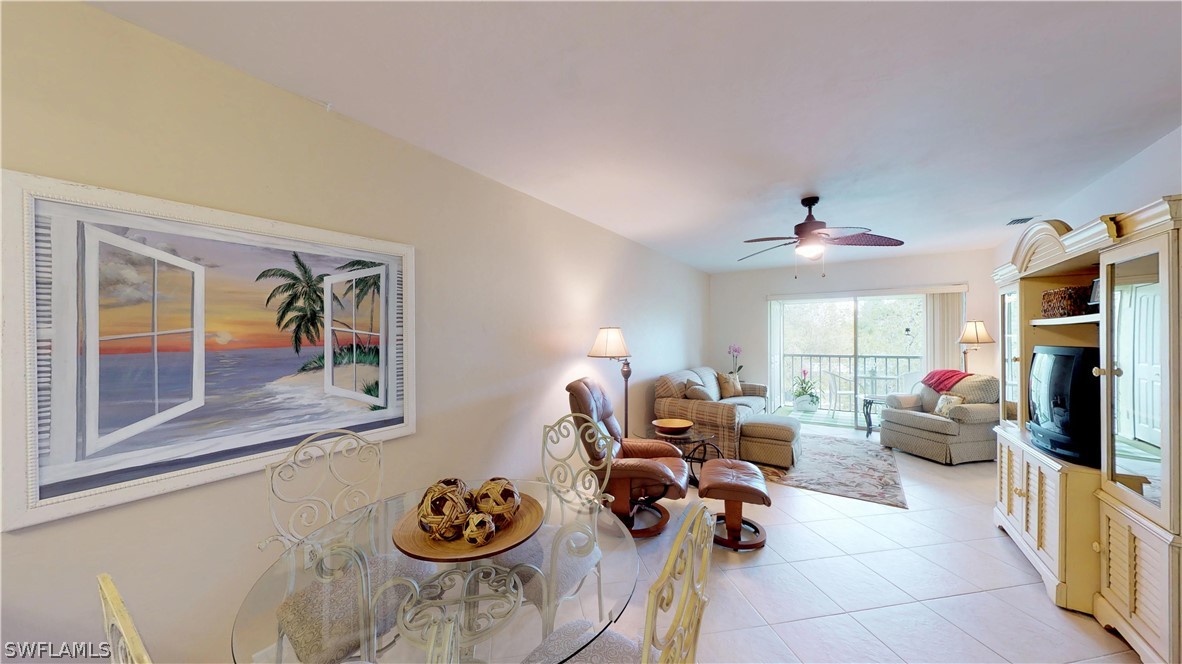 1100 Pondella Road, Unit 811 Cape Coral, FL 33909 - Photo 6 of 35 a living room with furniture and a flat screen tv