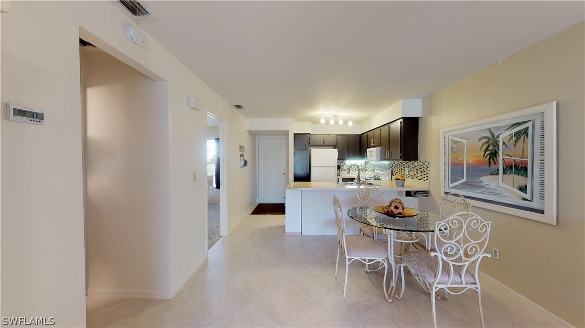 1100 Pondella Road, Unit 811 Cape Coral, FL 33909 - Photo 8 of 35 a dining room with furniture and window