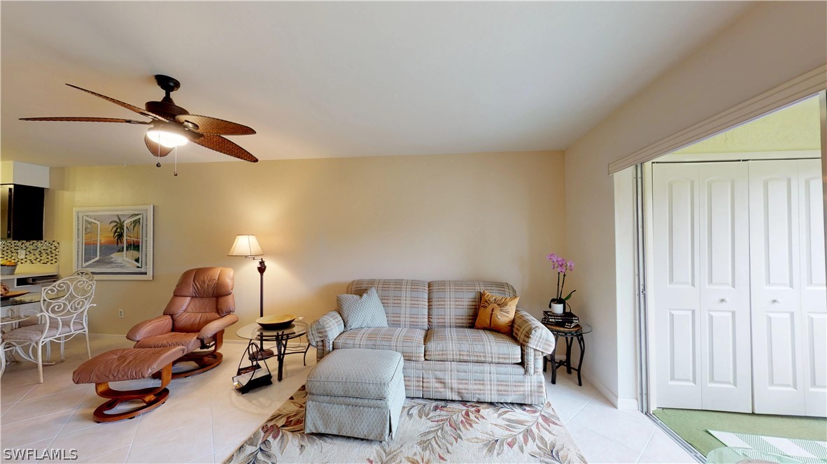 1100 Pondella Road, Unit 811 Cape Coral, FL 33909 - Photo 9 of 35 a living room with furniture and a ceiling fan