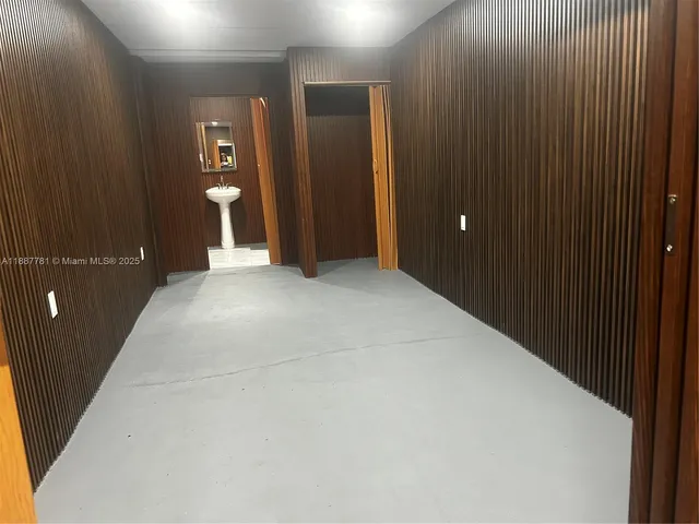 a view of an empty room with closet area