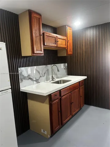 a bathroom with a sink double vanity and a mirror