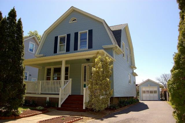 57 Redfield Road Fairfield, CT 06824 - Photo 1 of 1 a front view of a house with a yard