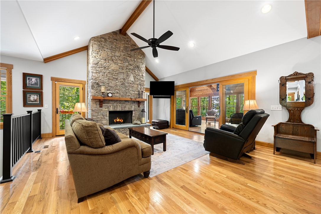 285 Bertha Allen Road Westminster, SC 29693 - Photo 12 of 50 A spacious living area features high vaulted ceilings and gleaming hardwood floors, anchored by a magnificent stone fireplace.