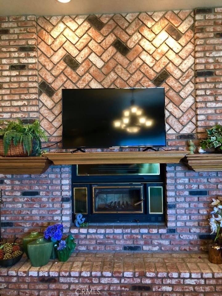 9126 Kittering Road Oak Hills, CA 92344 - Photo 12 of 47 fireplace in family area
