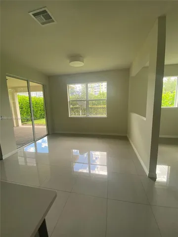 a view of an empty room and window