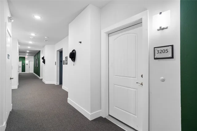 a kitchen with appliances a sink and cabinets