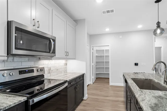 a view of a kitchen counter and a sink