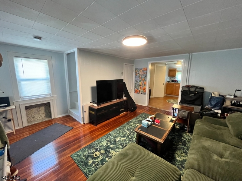 9 New Row Road, Unit A Hibernia, NJ 07842 - Photo 6 of 18 a living room with furniture and a flat screen tv