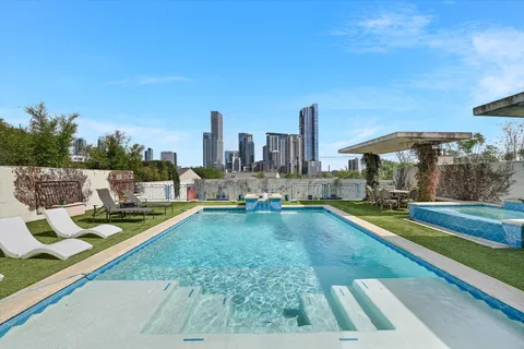 a view of swimming pool from a patio