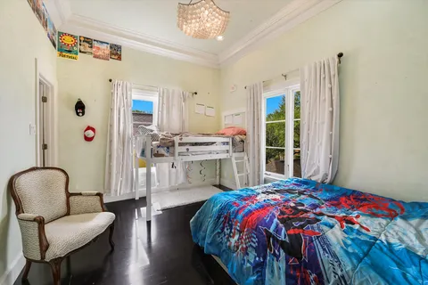 a bedroom with a bed and a chair