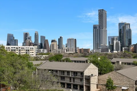a aerial view of a city with tall buildings