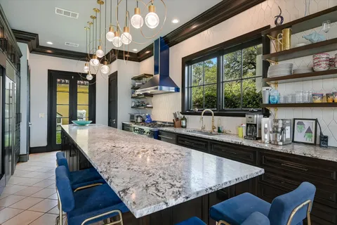 a kitchen with granite countertop lots of counter top space and dining table