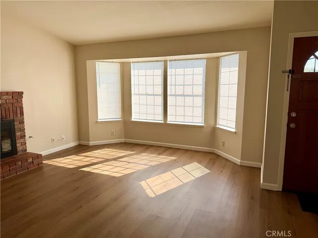 a view of an empty room and window