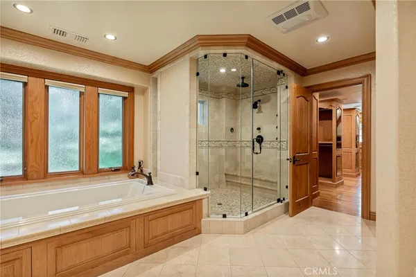 a bathroom with a sink double vanity and shower