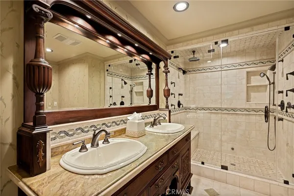 a living room with furniture and floor to ceiling windows