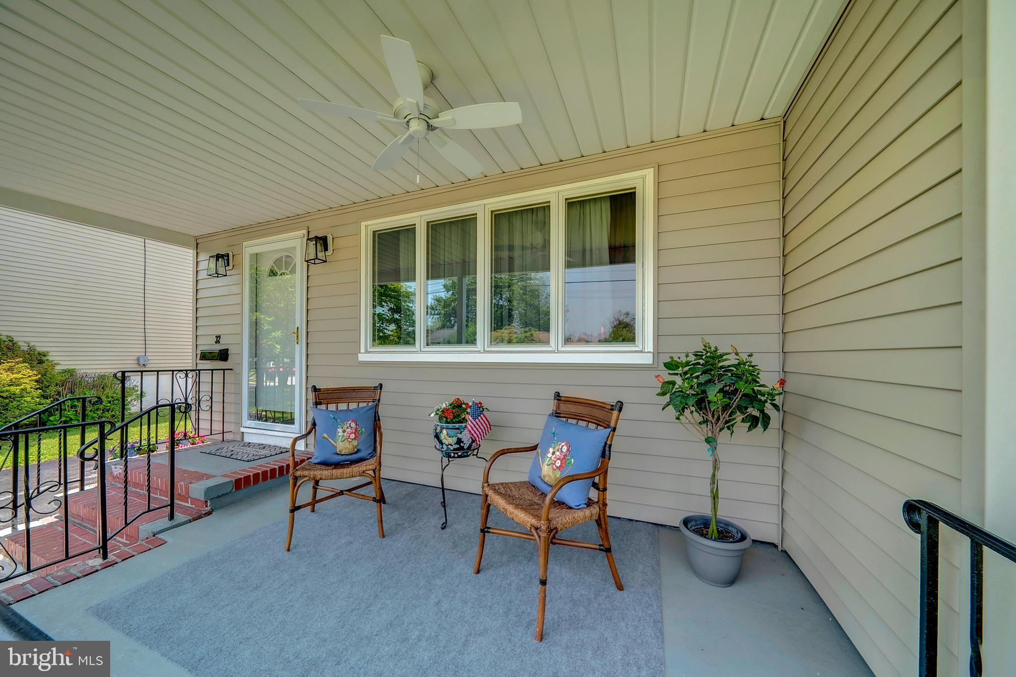 32 Sherbrooke Road Ewing, NJ 08638 - Photo 4 of 47 a view of a porch with chairs and potted plants