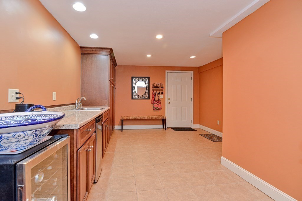 40 Southboro Road Upton, MA 01568 - Photo 36 of 42 a view of a kitchen with a sink and a refrigerator