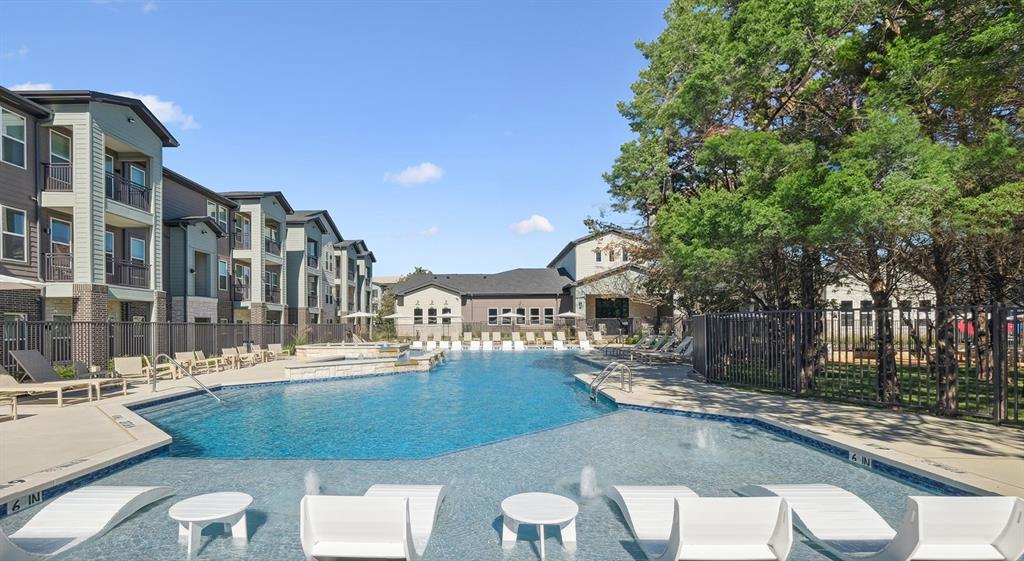 4600 East McKinney Street, Unit 5317 Denton, TX 76208 - Photo 17 of 40 a view of a swimming pool with a lounge chairs