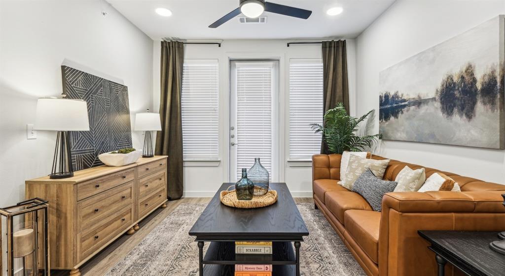4600 East McKinney Street, Unit 5317 Denton, TX 76208 - Photo 30 of 40 a living room with furniture and wooden floor