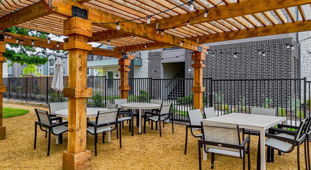4600 East McKinney Street, Unit 5317 Denton, TX 76208 - Photo 6 of 40 a patio with tables and chairs with potted plants