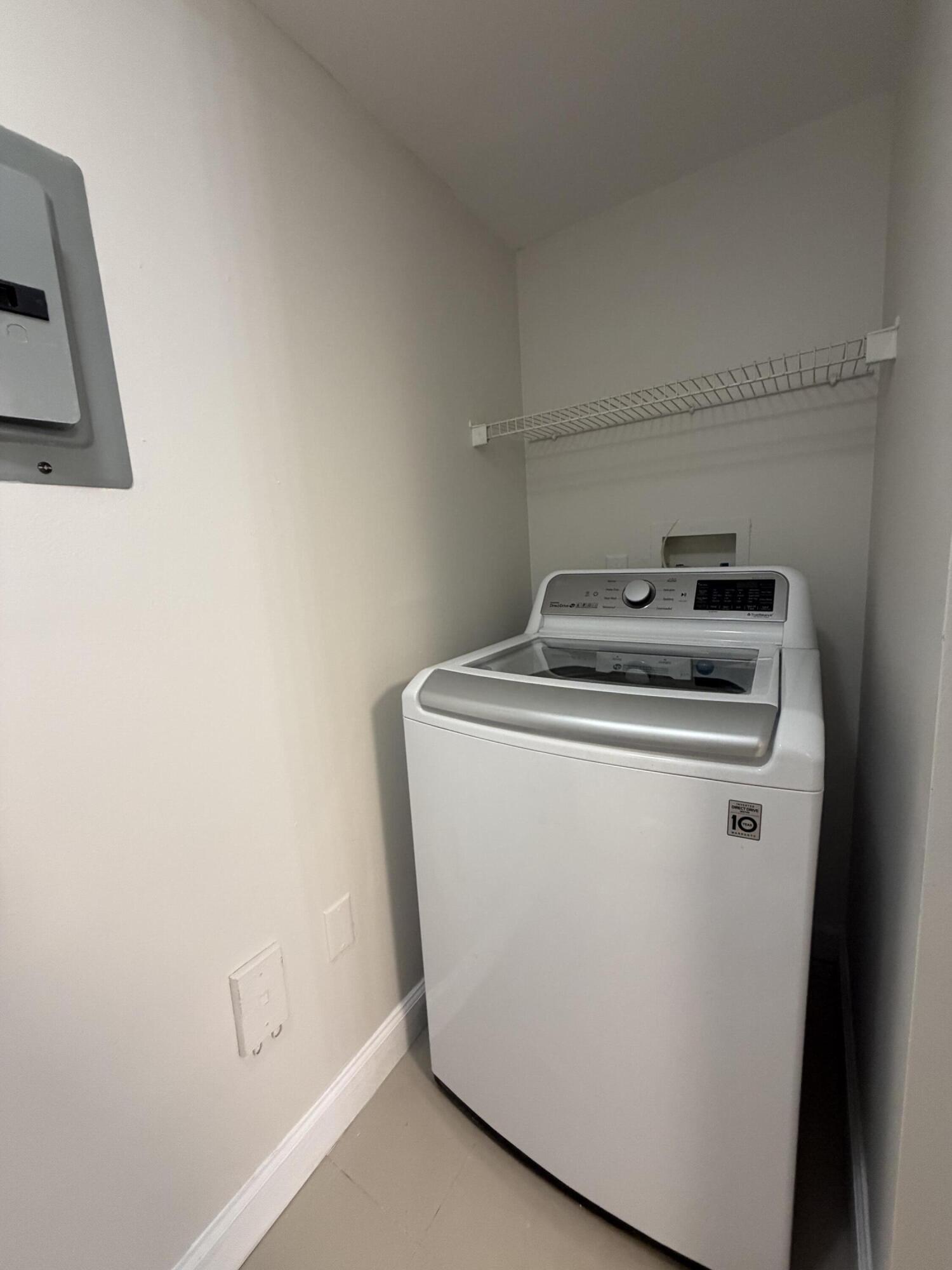 5031 Wiles Road, Unit 203 Coconut Creek, FL 33073 - Photo 12 of 24 a utility room with dryer and washer