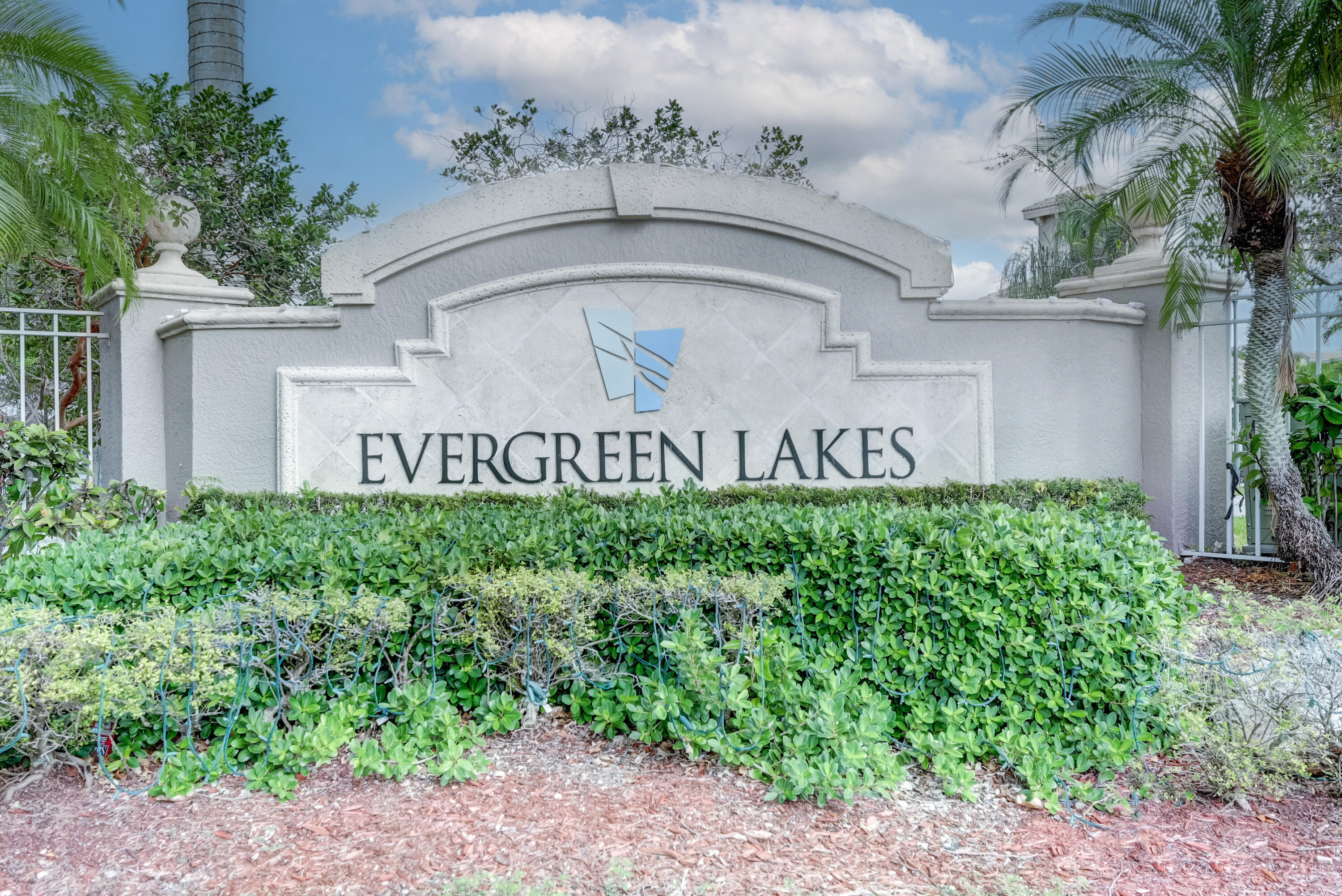 5031 Wiles Road, Unit 203 Coconut Creek, FL 33073 - Photo 2 of 24 a sign on the side of a building