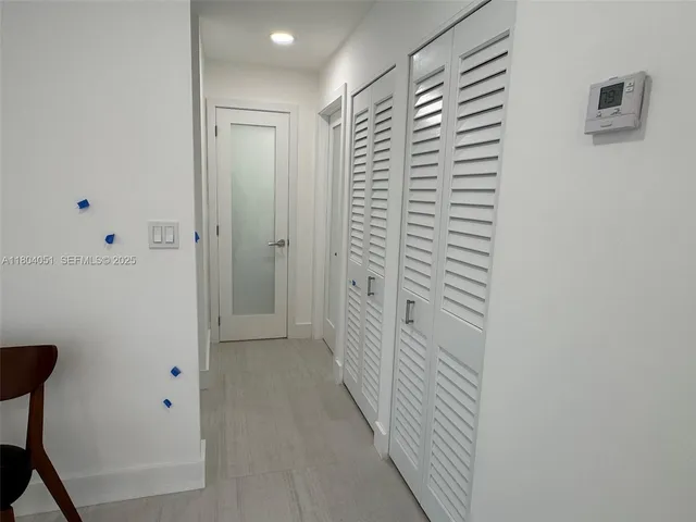 a view of a hallway with closet