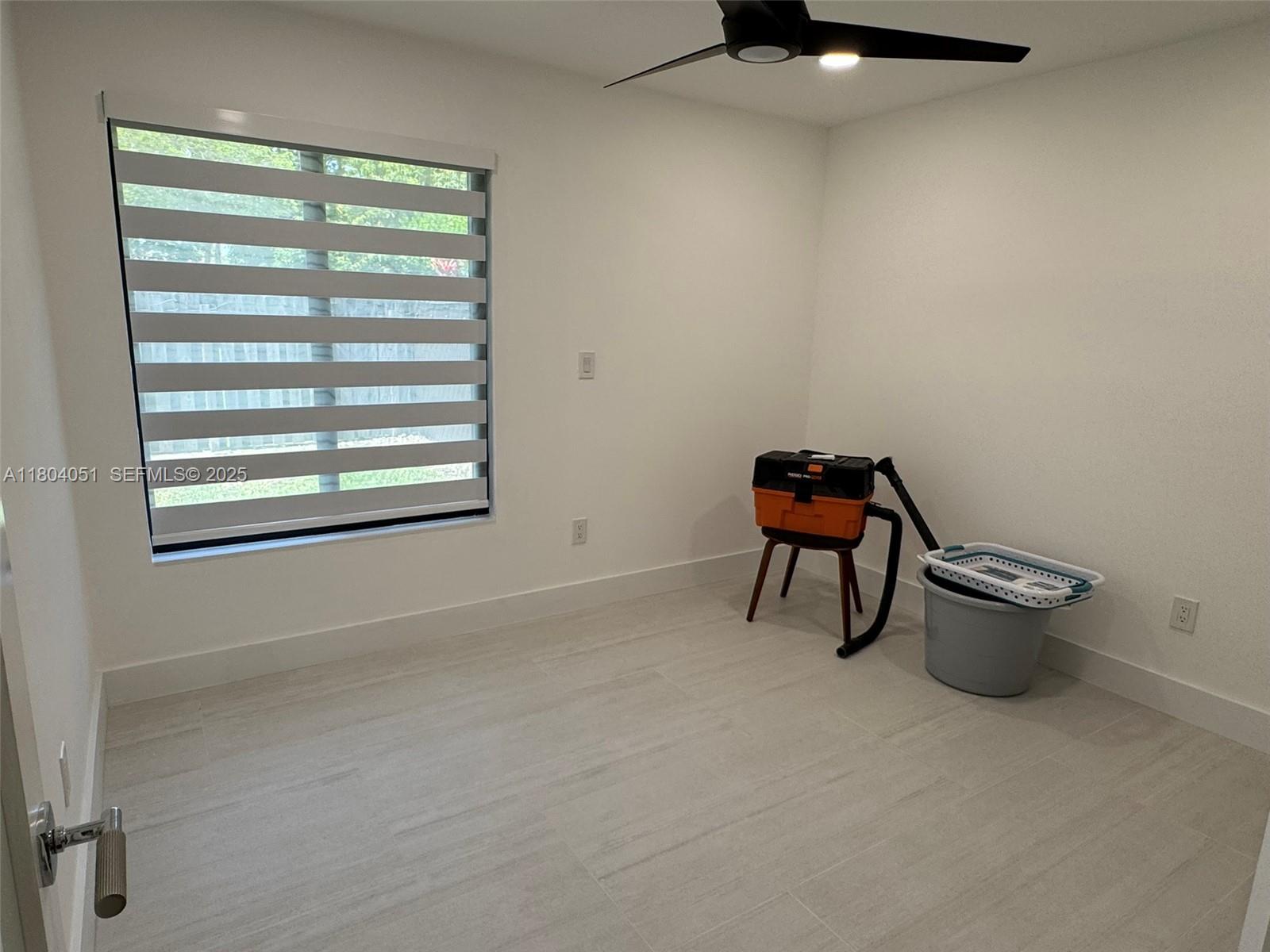 12721 Southwest 68th Terrace Miami, FL 33183 - Photo 18 of 31 a workspace with a window