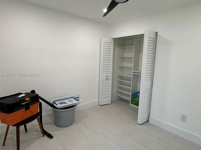 a bathroom with a sink toilet and mirror