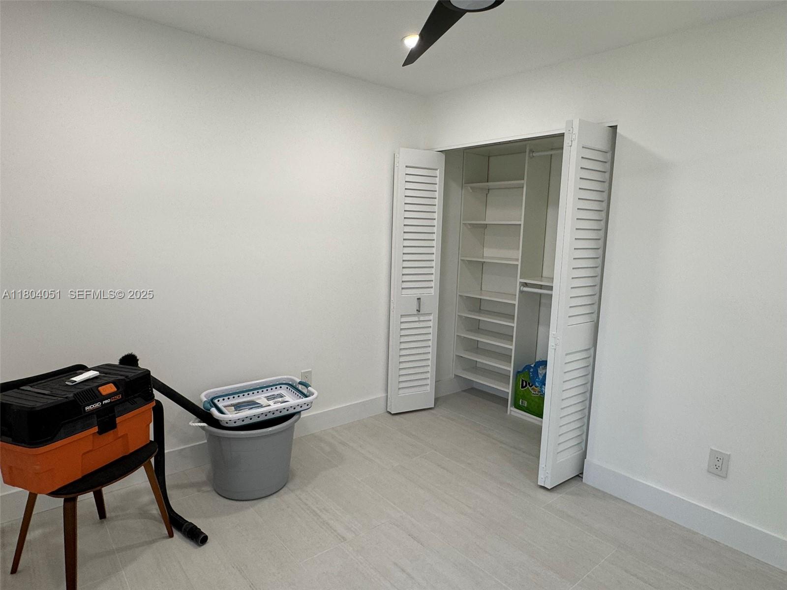 12721 Southwest 68th Terrace Miami, FL 33183 - Photo 19 of 31 a living room with furniture and a potted plant