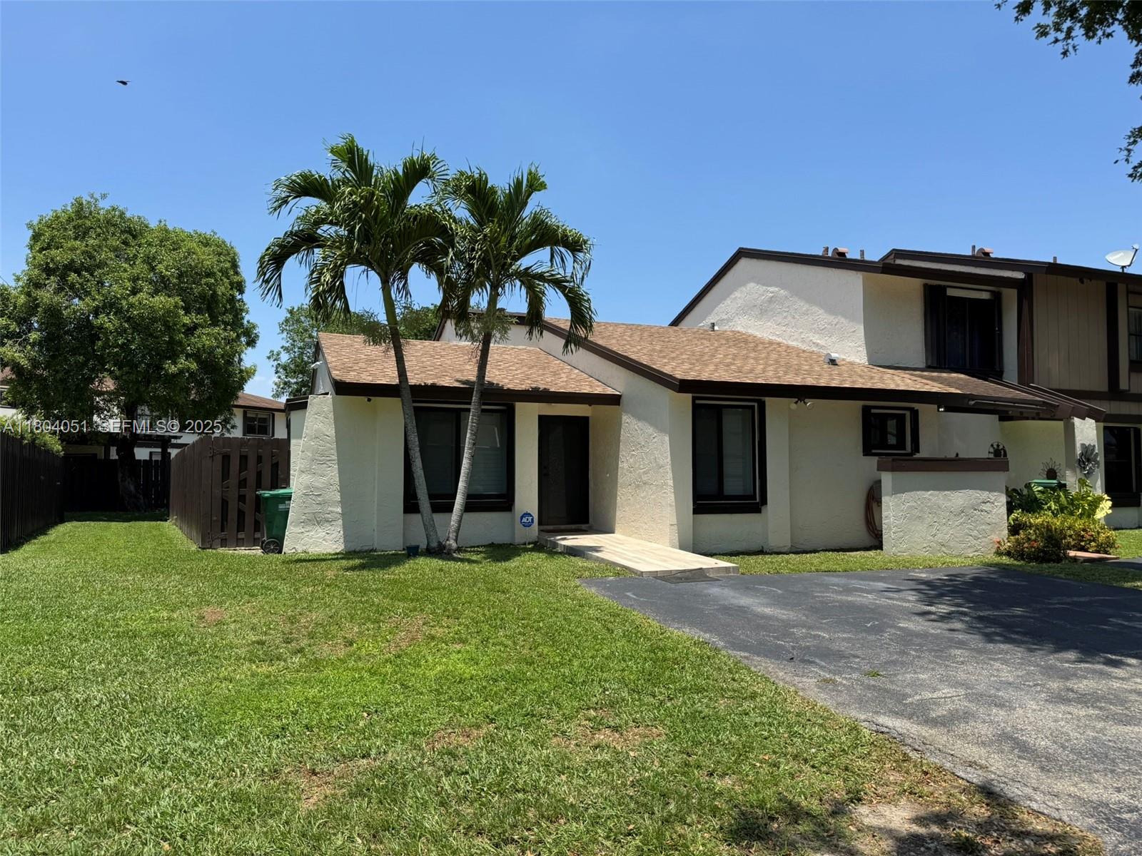 12721 Southwest 68th Terrace Miami, FL 33183 - Photo 2 of 31 a view of a house with a yard and potted plants