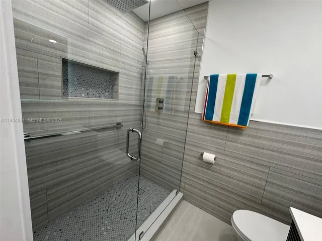 a view of a hallway with a window