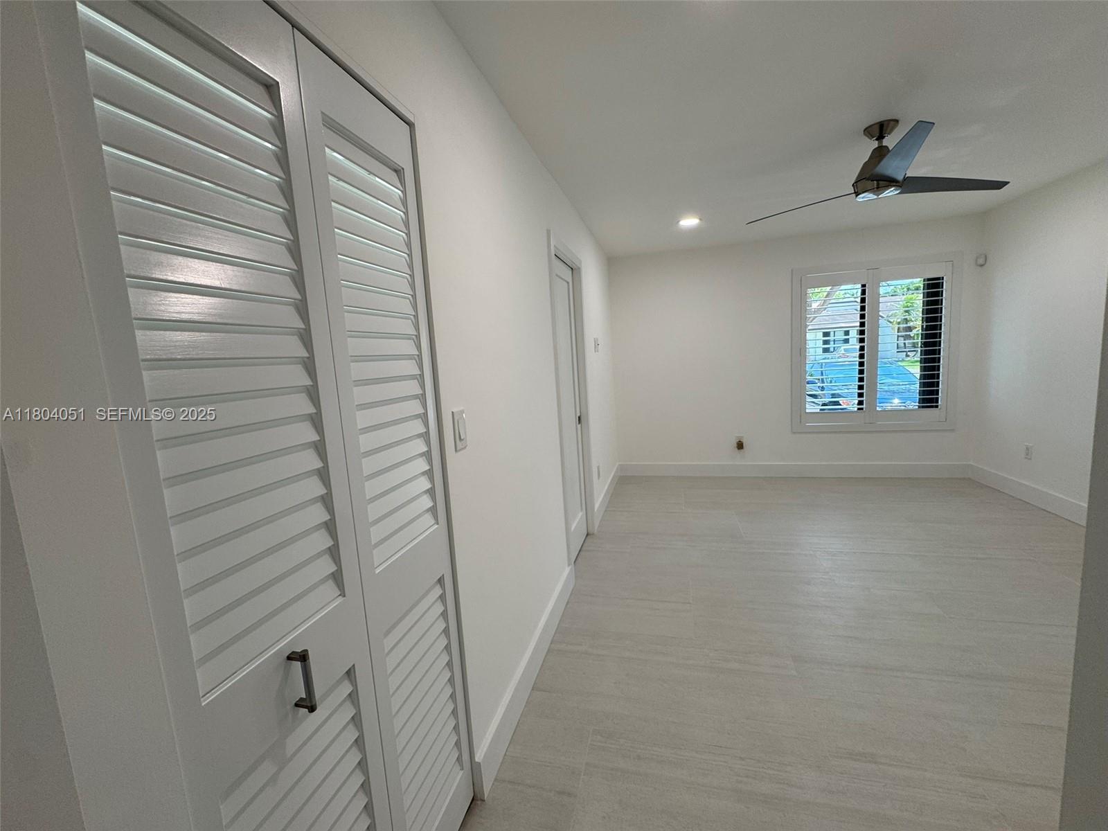 12721 Southwest 68th Terrace Miami, FL 33183 - Photo 22 of 31 a view of a hallway with a window
