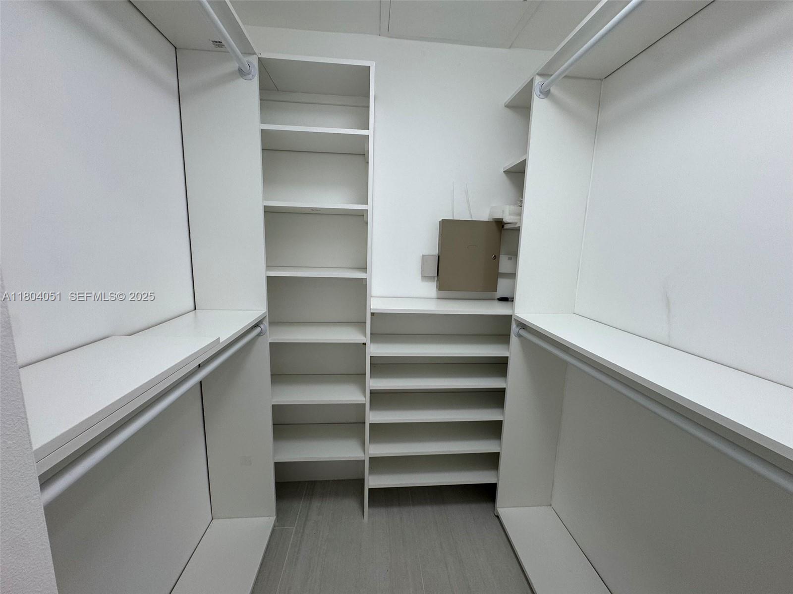 12721 Southwest 68th Terrace Miami, FL 33183 - Photo 24 of 31 a view of walk in closet with empty racks