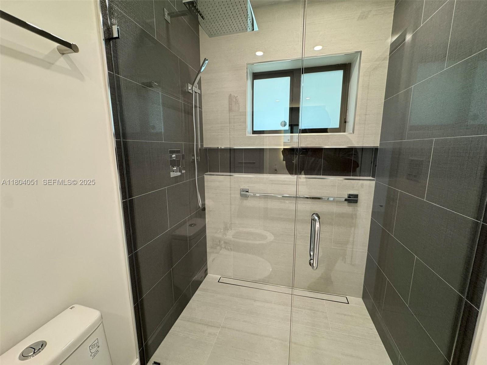 12721 Southwest 68th Terrace Miami, FL 33183 - Photo 26 of 31 a bathroom with a shower