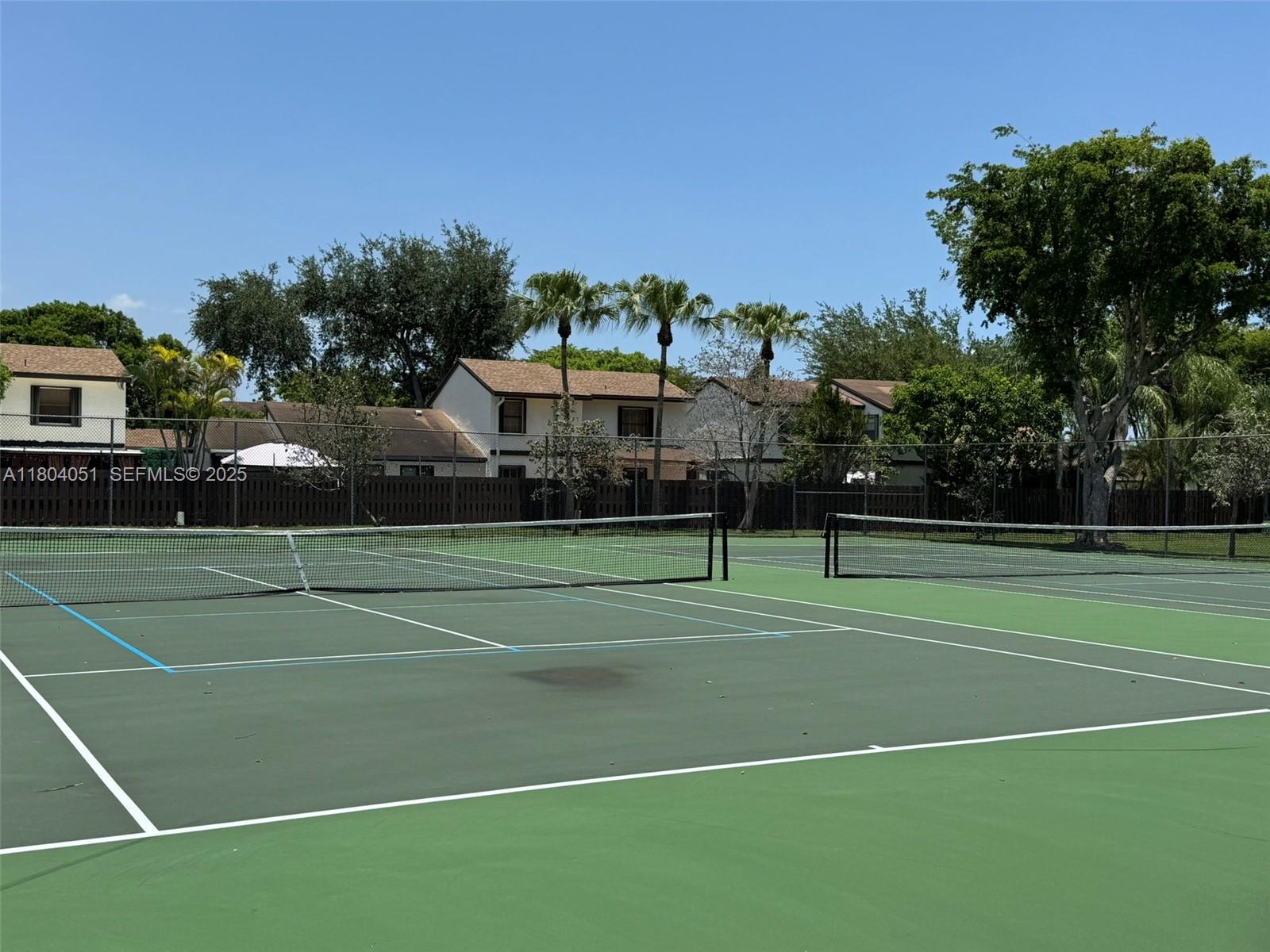 12721 Southwest 68th Terrace Miami, FL 33183 - Photo 27 of 31 a view of a tennis ground with large trees