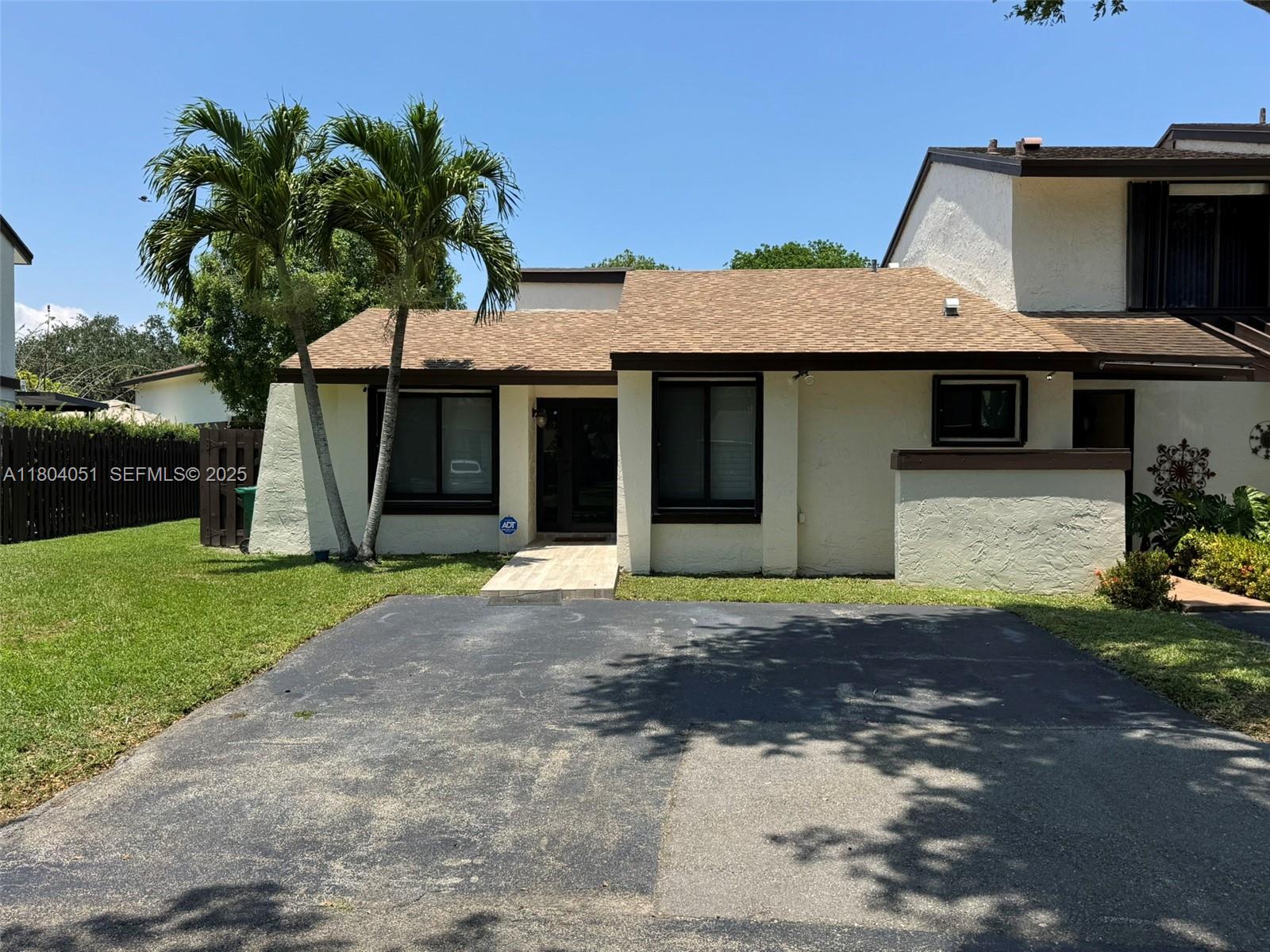 12721 Southwest 68th Terrace Miami, FL 33183 - Photo 3 of 31 a front view of a house with garden