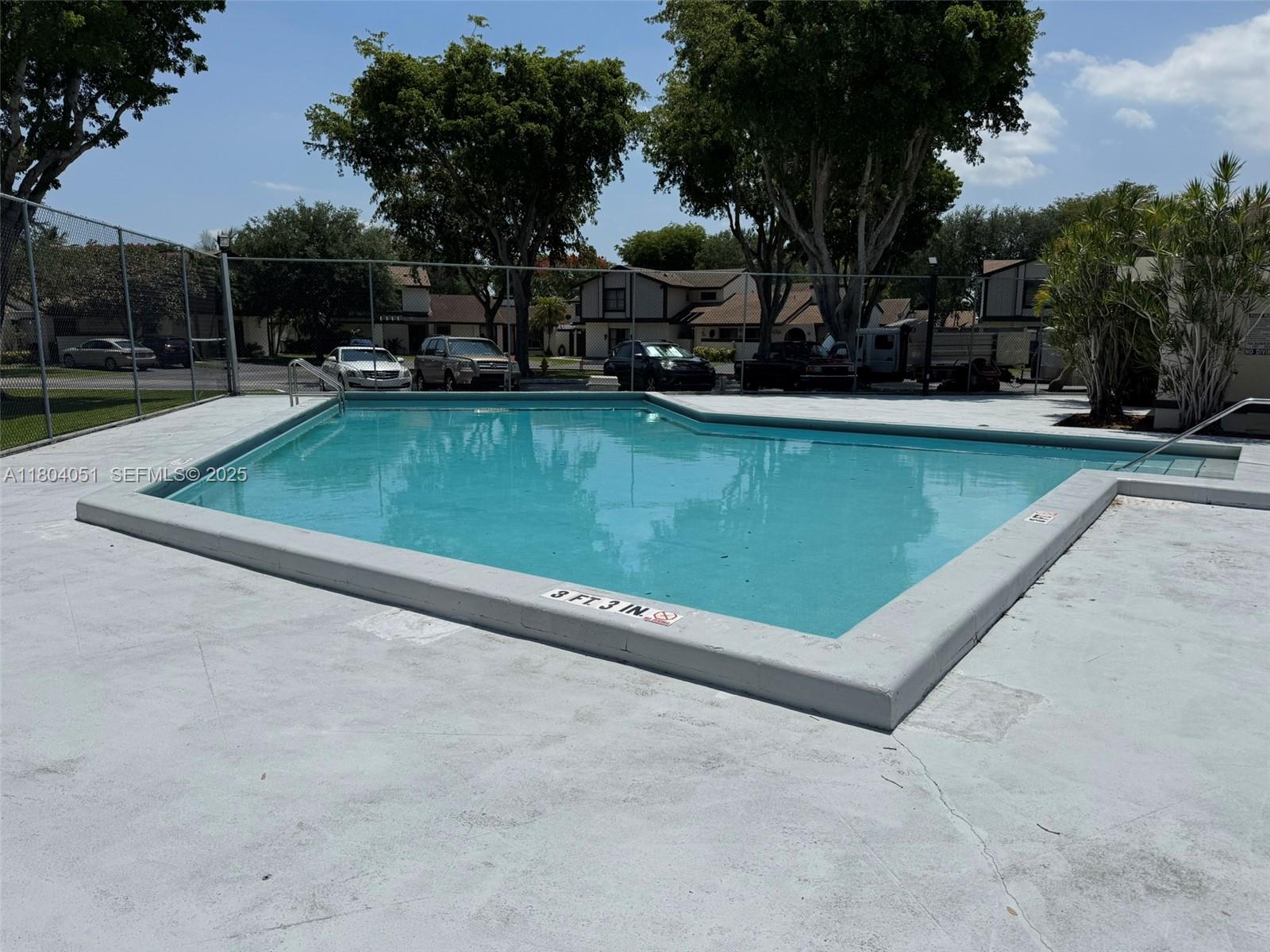 12721 Southwest 68th Terrace Miami, FL 33183 - Photo 31 of 31 a view of a pool with a yard and plants