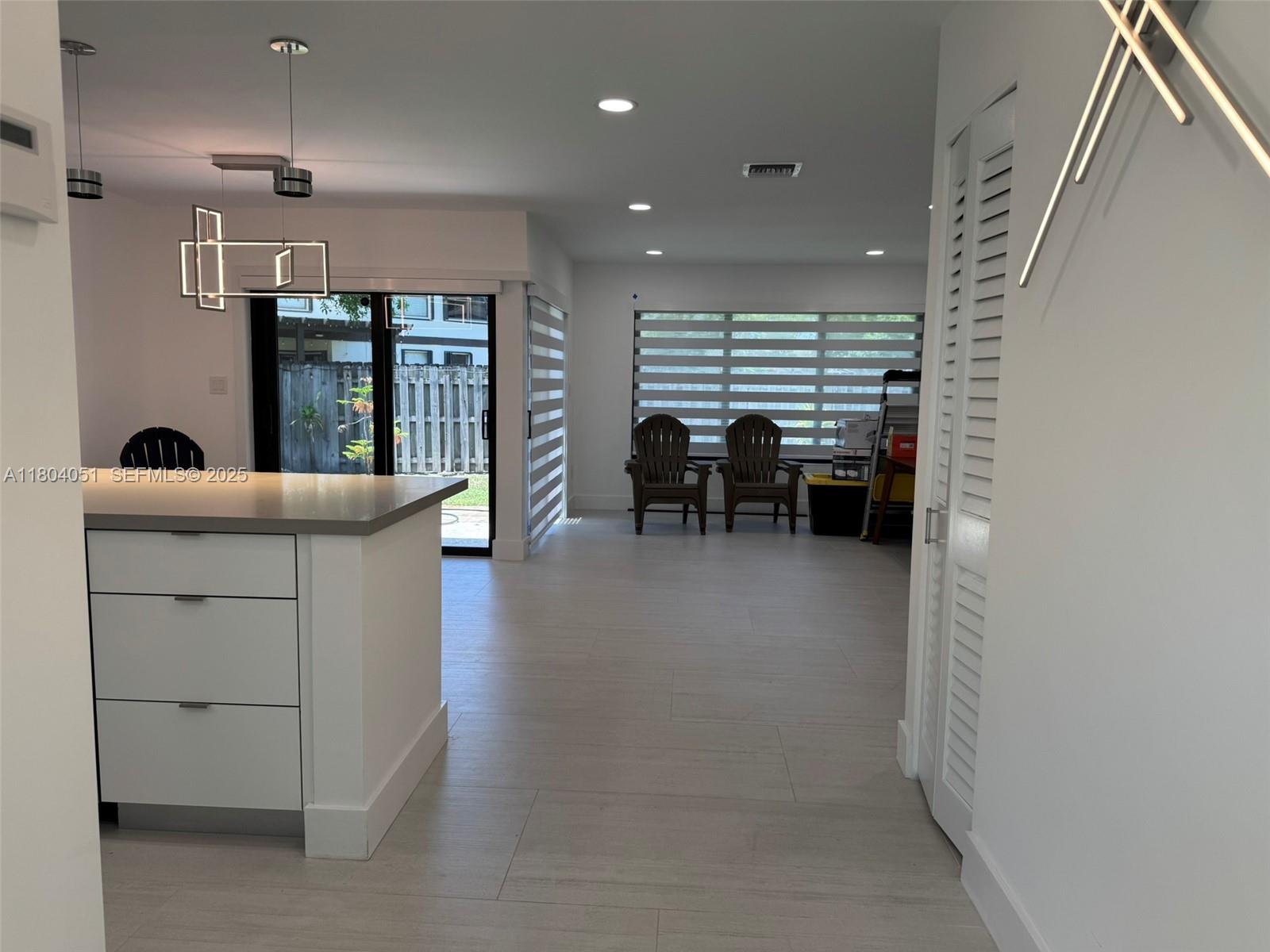 12721 Southwest 68th Terrace Miami, FL 33183 - Photo 4 of 31 an empty room with furniture and window