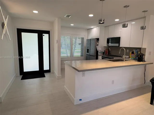 a bed room with a bed and a chair