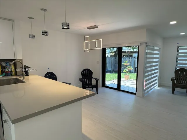 a view of balcony with wooden floor and lake view